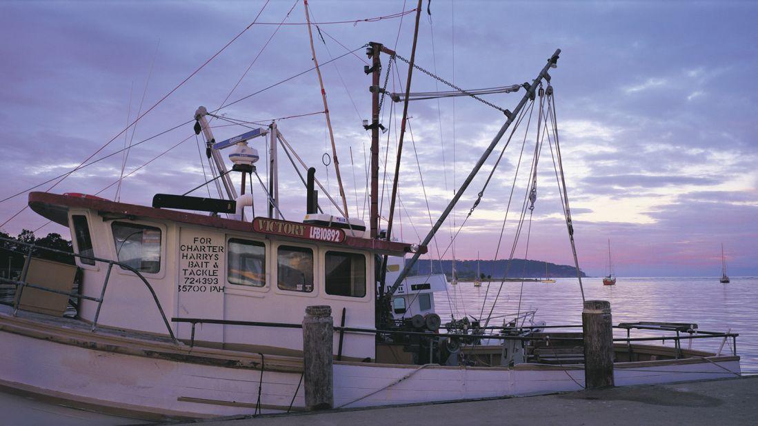 <strong>Batemans Bay, NSW: </strong>A<strong> </strong>fishing boat docked at the wharf at sunrise, Batemans Bay, Eurobodalla. Kayak tours are a great way to take in the area. 